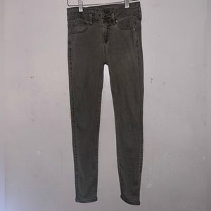 Guess skinny pants faded green with gold accents